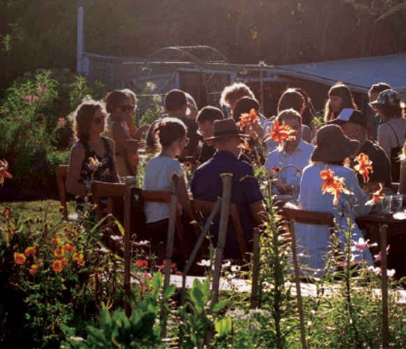people dining in a community garden